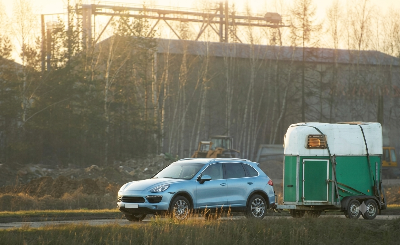 SUV towing a trailer for professional transport